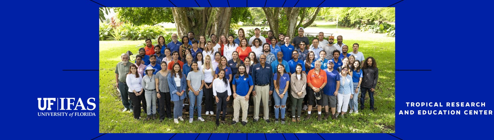 A group of people in a tropical setting at the UF/IFAS TREC
