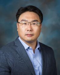 Dr. Young Gu Her