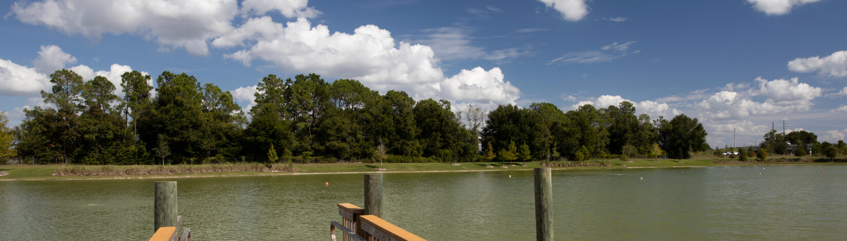 A dock at a retention pond in a neighborhood in the Villages